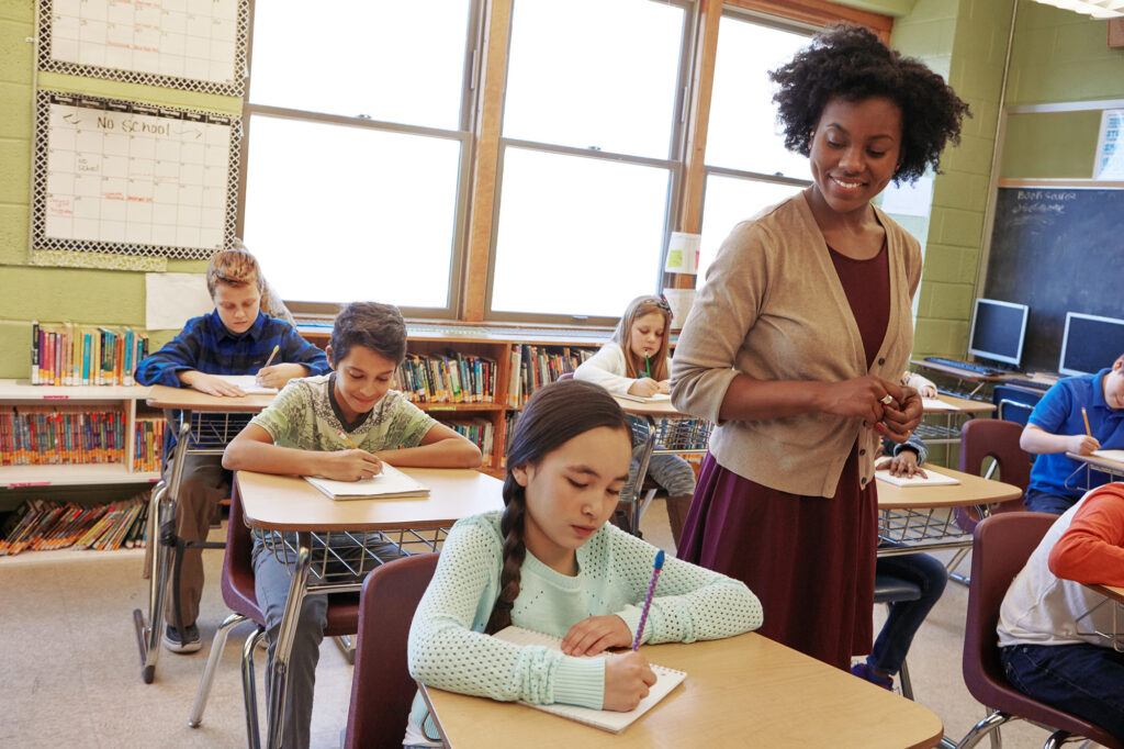 A teacher in a classroom with her students