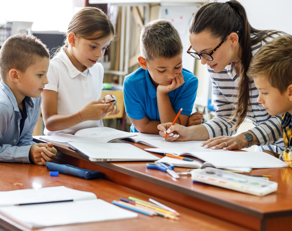 Teacher showing group of students some documents