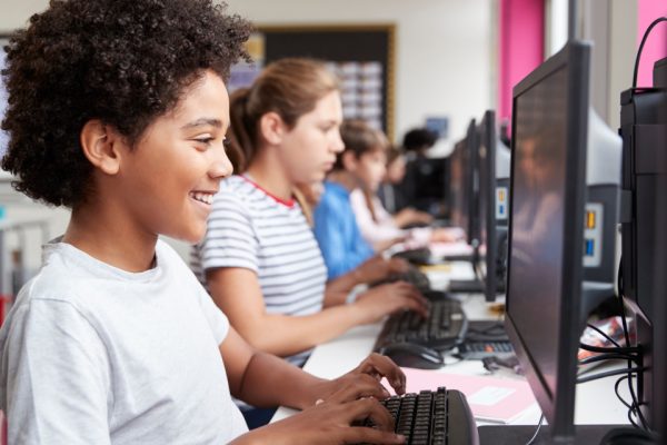 Kids working on computers in a computer lab